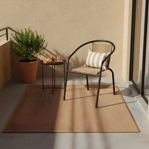 Fauteuil acier noir assise en cordage marron clair style rotin